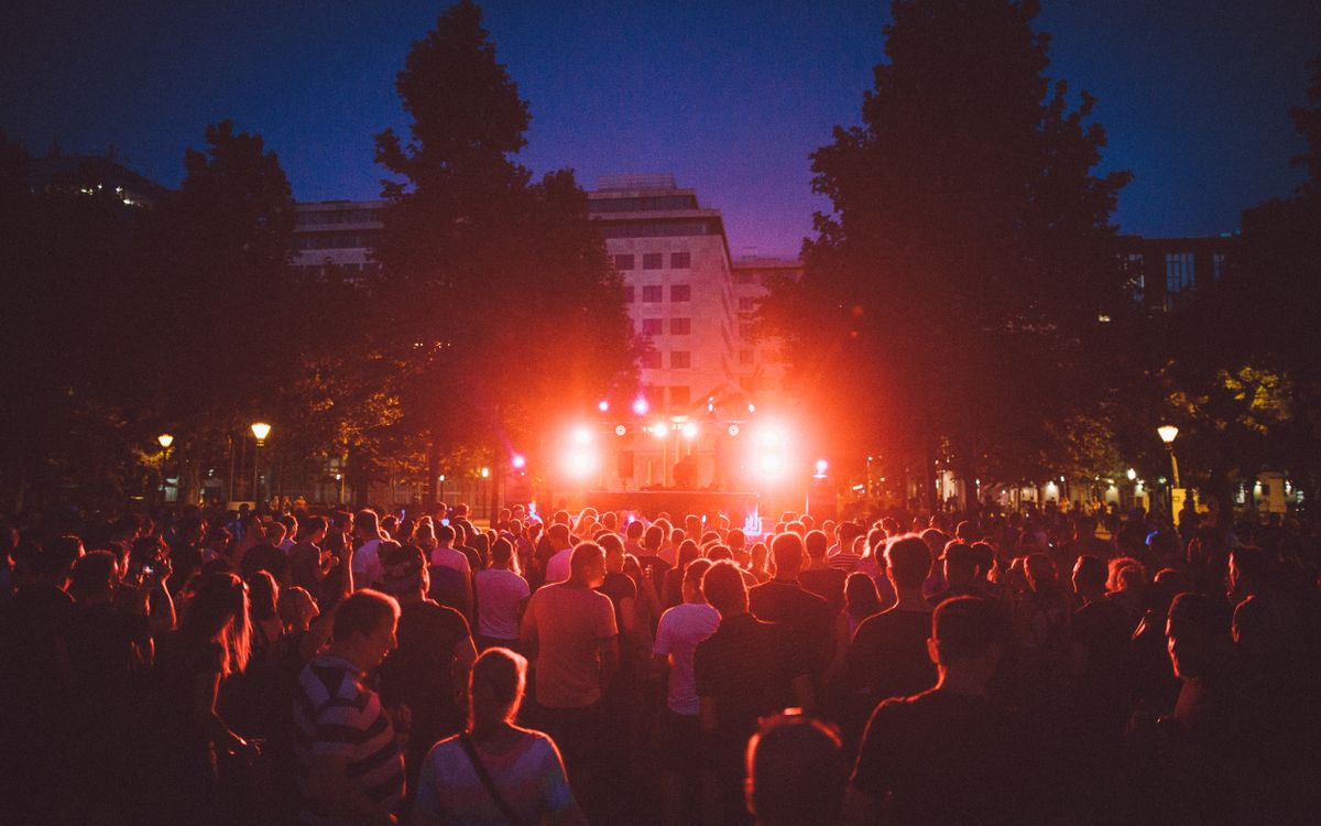 Large outdoor electronic music festival at night