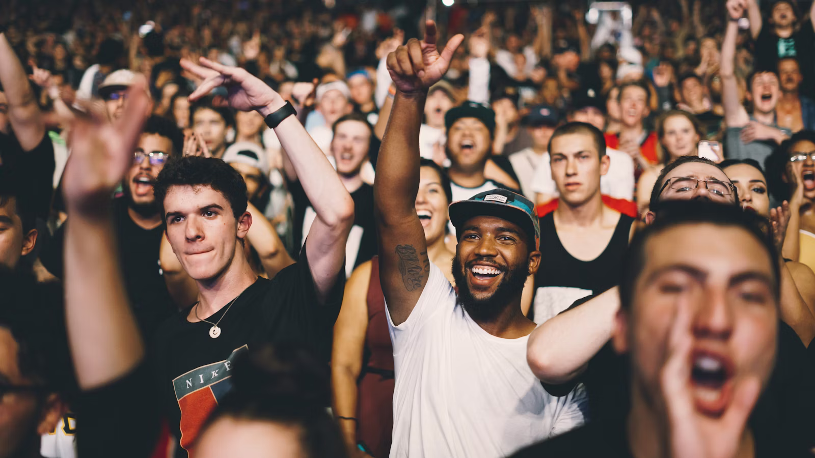 Festival crowd under stage lights