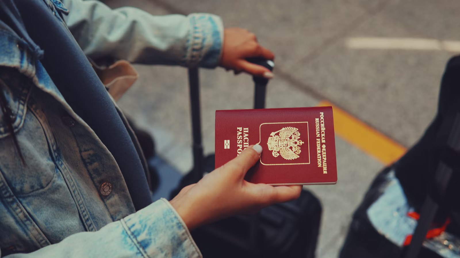 A traveller holding a passport