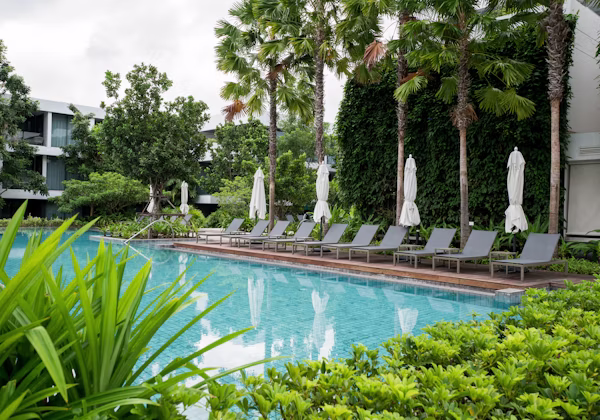Poolside view of a tropical residential property