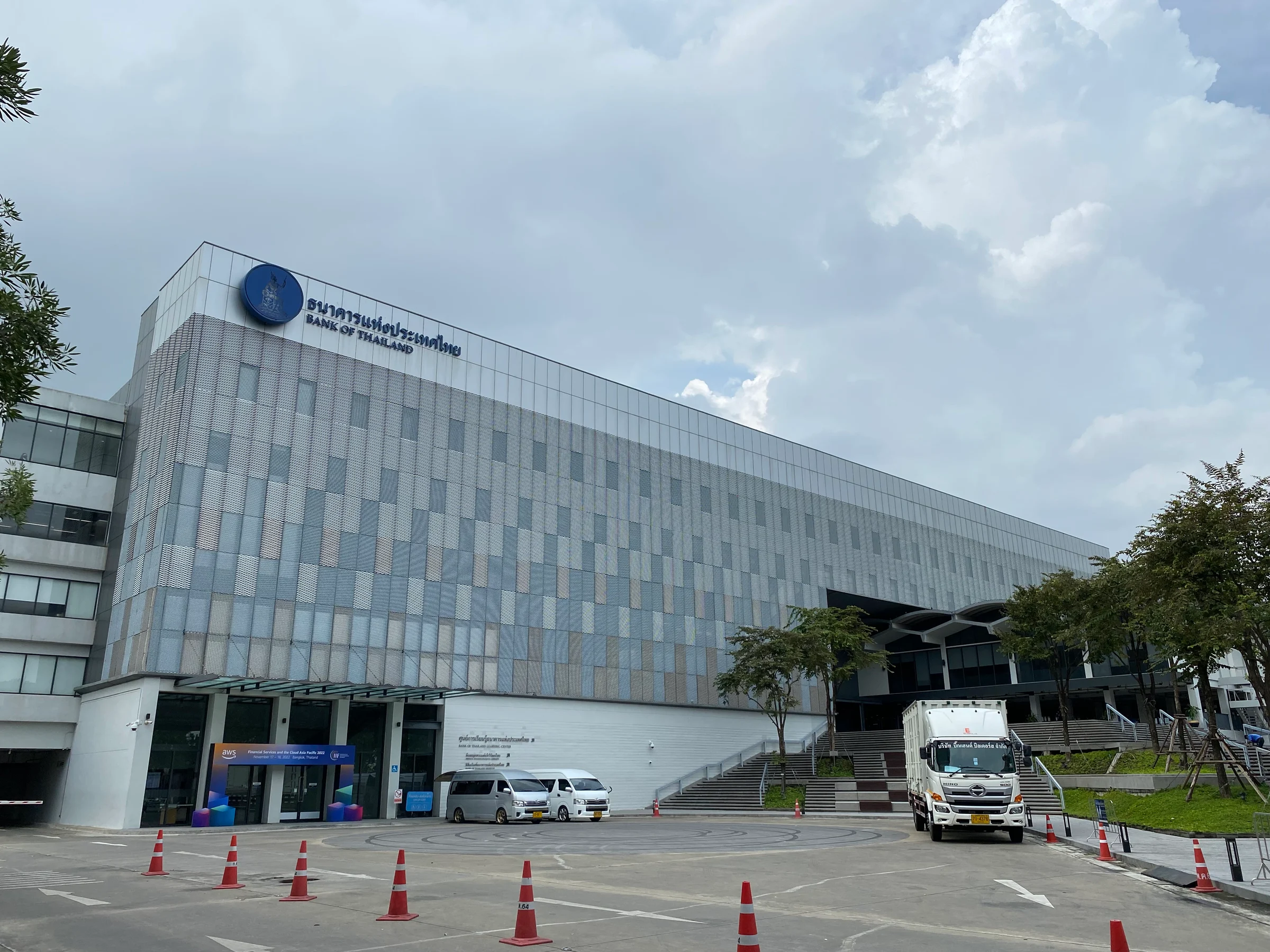 The modern grey facade of the Bank of Thailand Learning Center building in Bangkok, with the Bank of Thailand sign in Thai and English