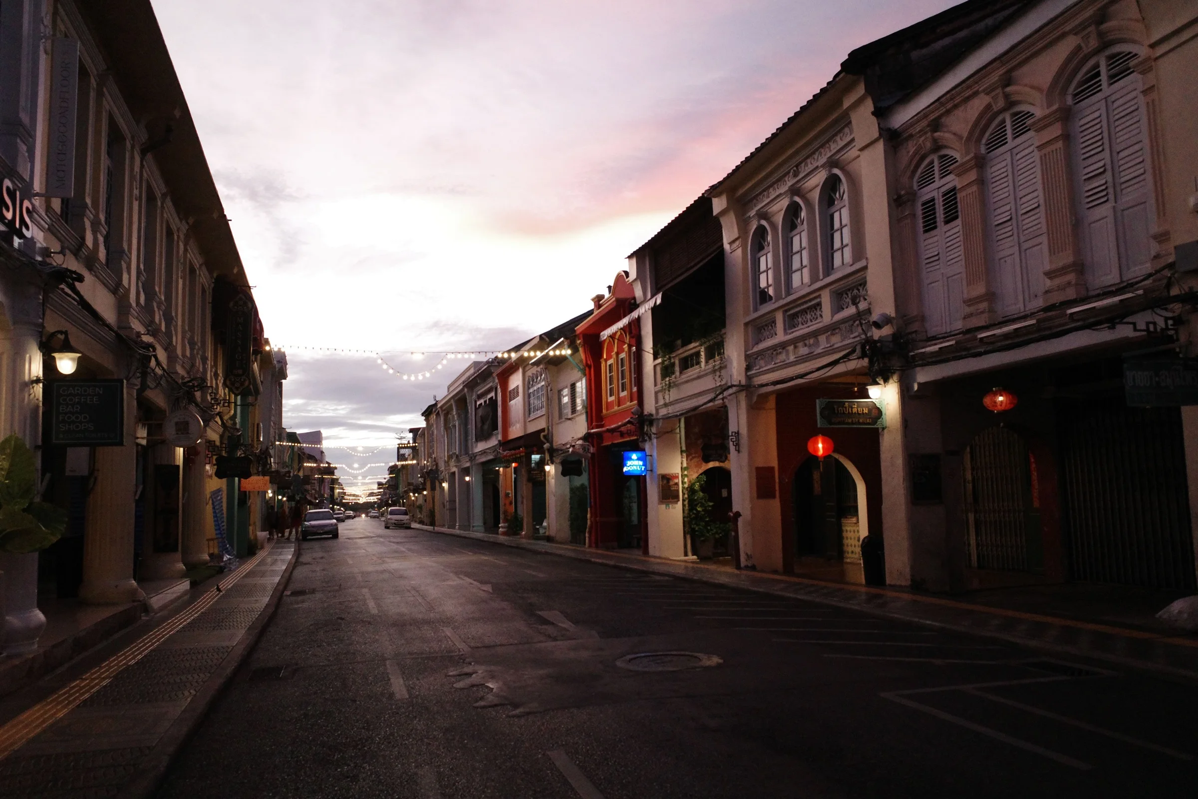 Quiet street lined with Sino-Portuguese buildings in Phuket Old Town at dusk