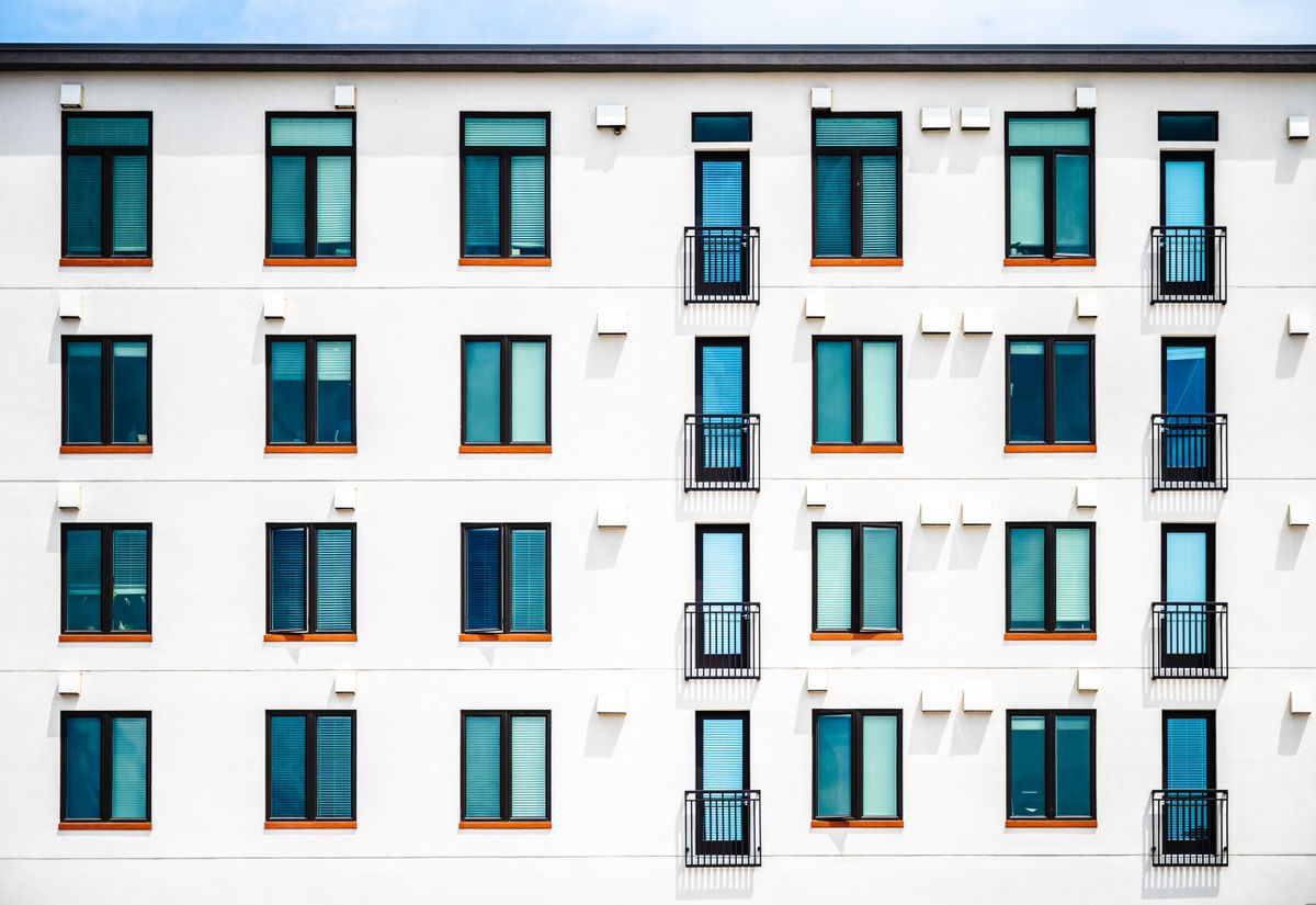 Contemporary condominium exterior against a clear sky