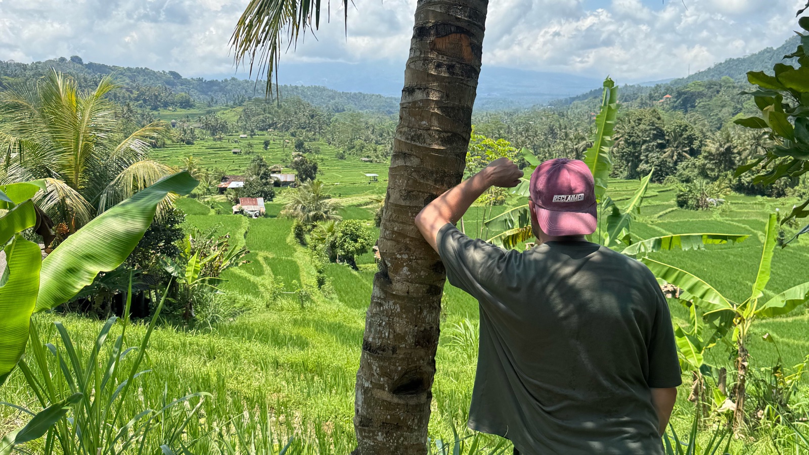 Rob Nyquist looking out over a green Bali landscape