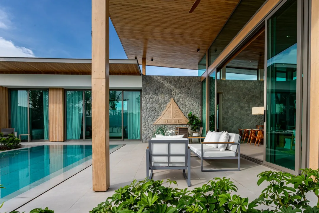 Covered seating terrace beside the B1 show villa pool